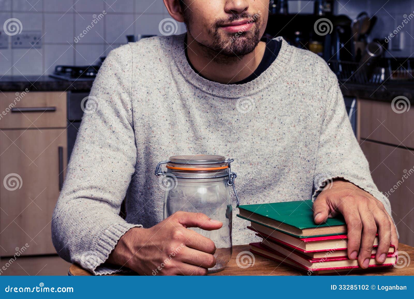 Man Sits On Glass Jar