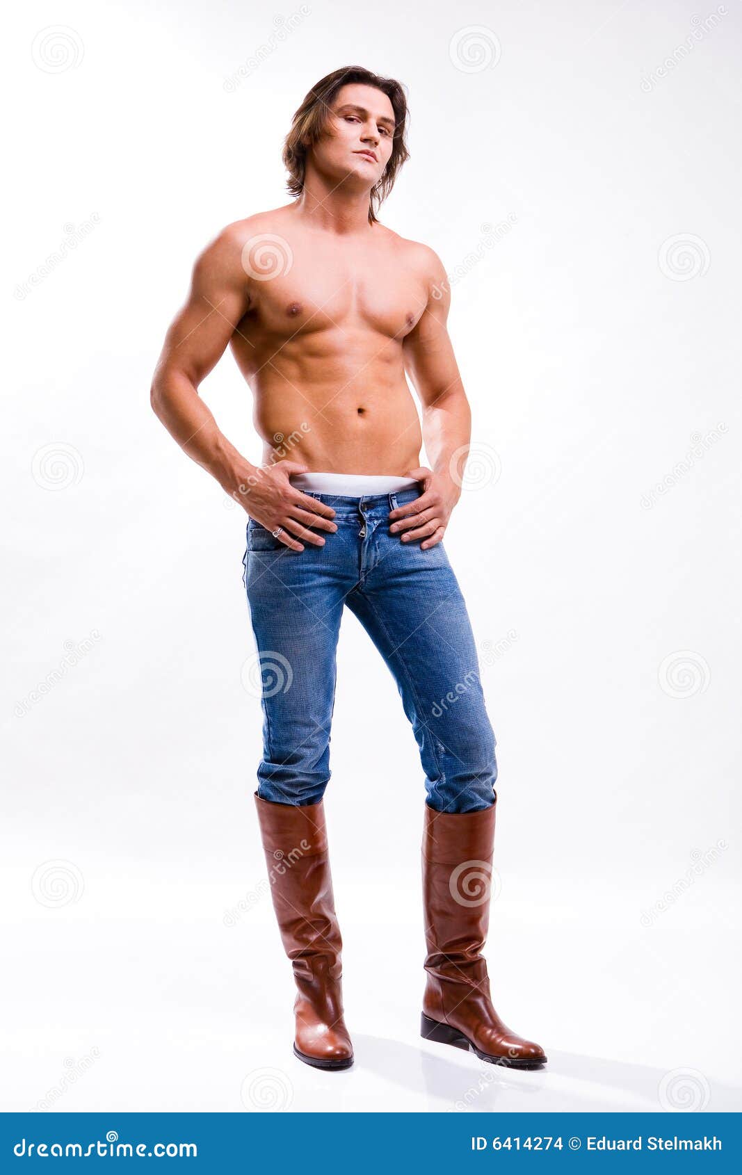 man in a jeans and boots. denuded torso