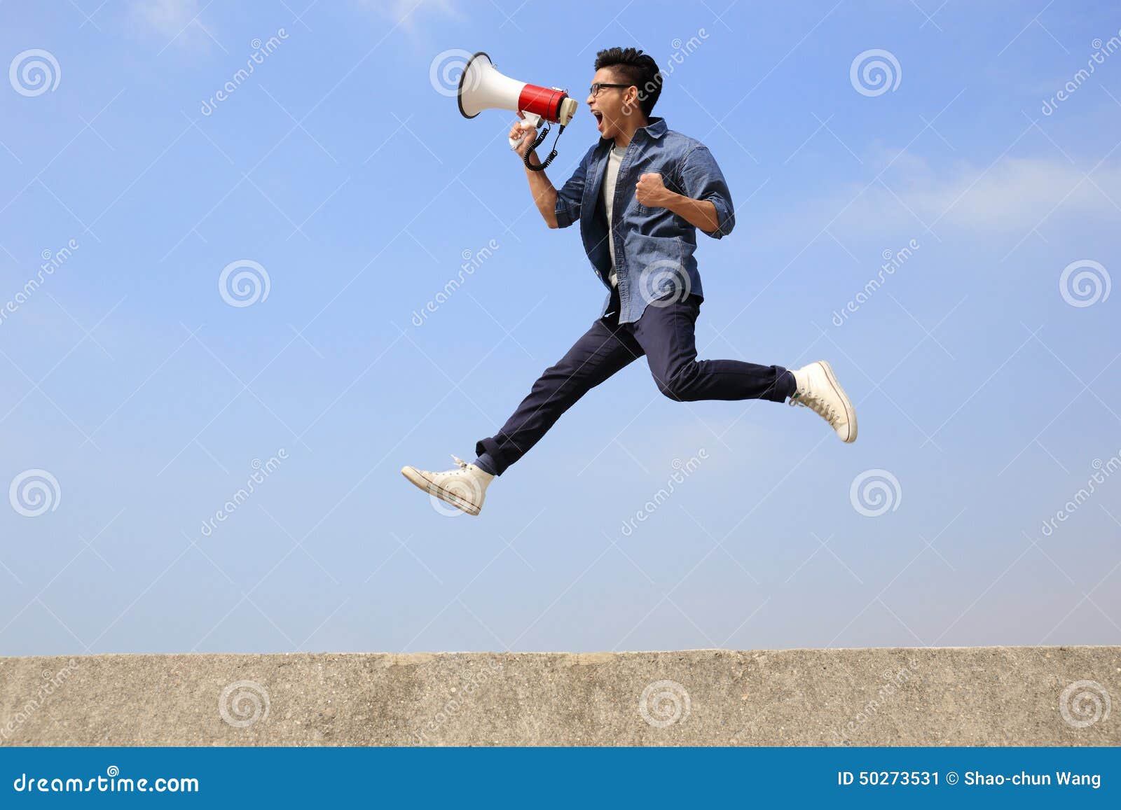 man jump and shout megaphone