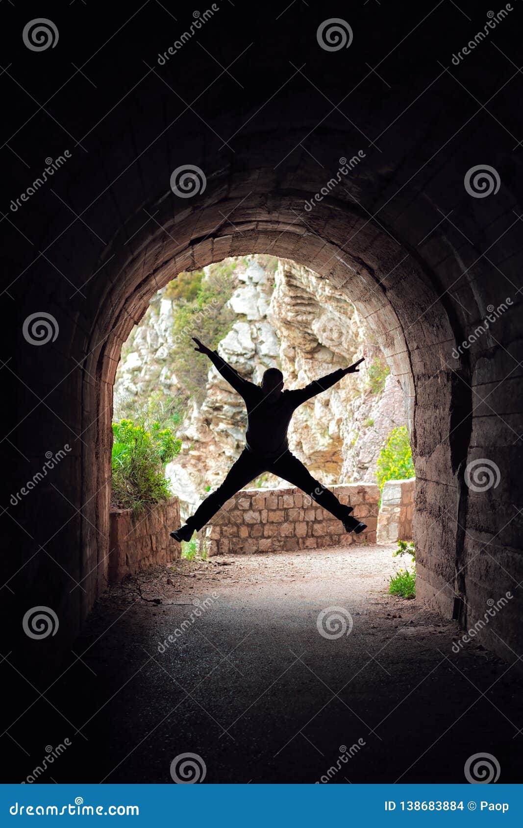 Man Jumping In A Dark Tunnel Stock Photo - Image of dark, cove: 138683884 Silhouette Man Walking Tunnel