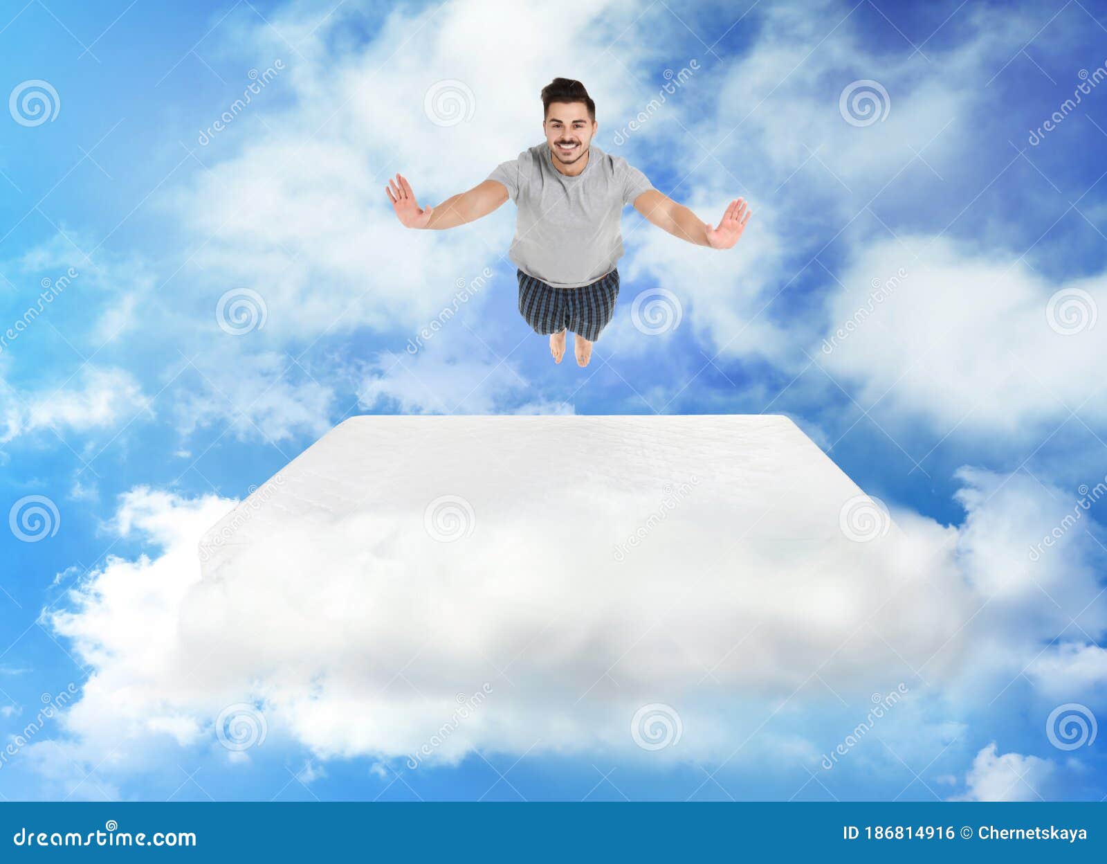 Man Jumping on Mattress in Clouds Stock Photo Image of fabric, health