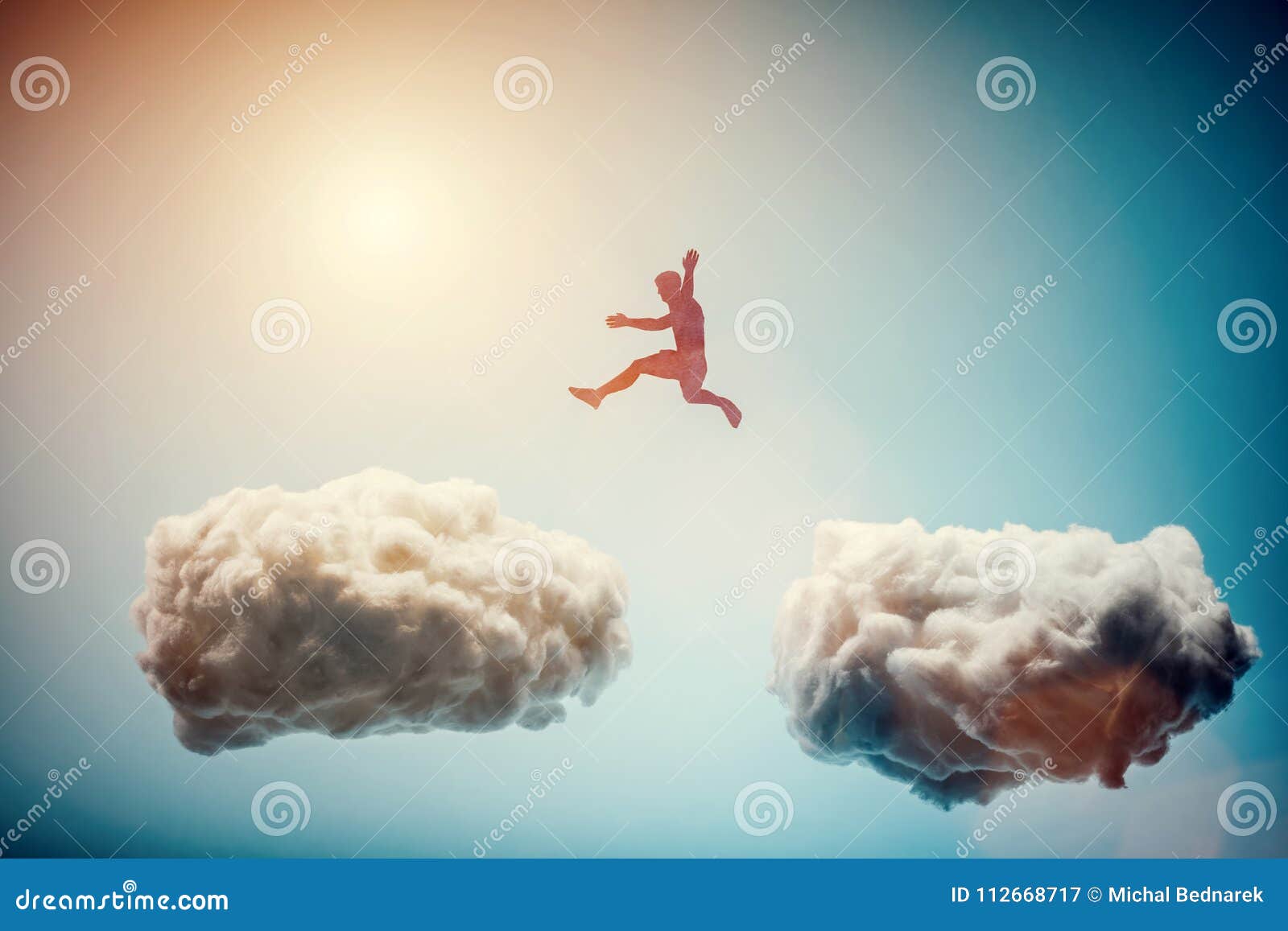 Man Jumping from One Cloud To Another. Challenge. Stock Image Image