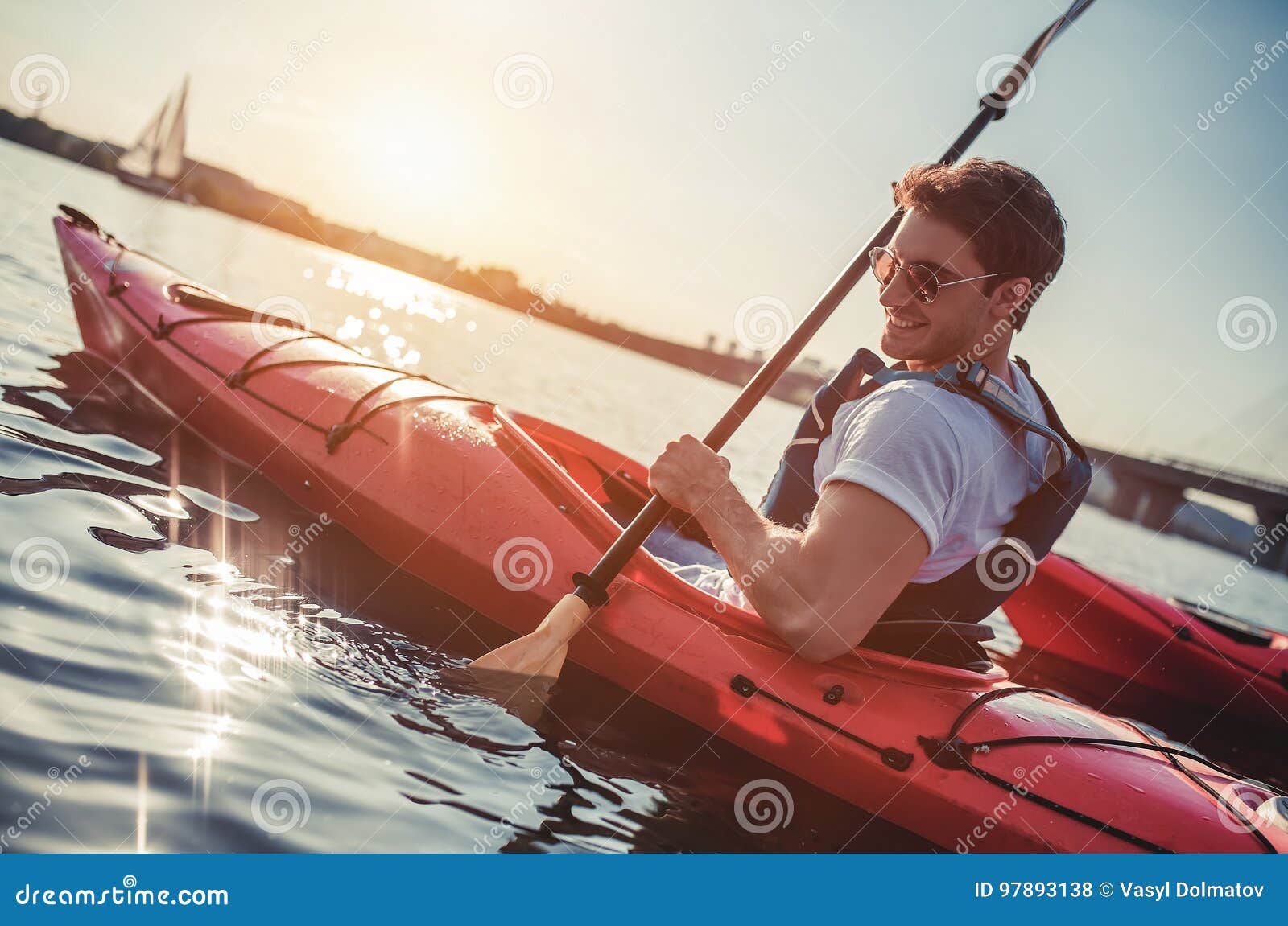 Man kayaking on sunset stock photo. Image of lake, floating 97893138