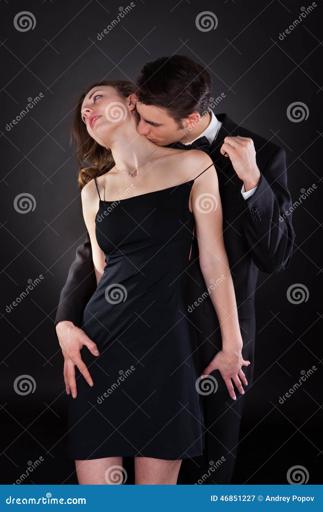 Man Kissing Woman on Neck while Removing Dress Strap Stock Image image