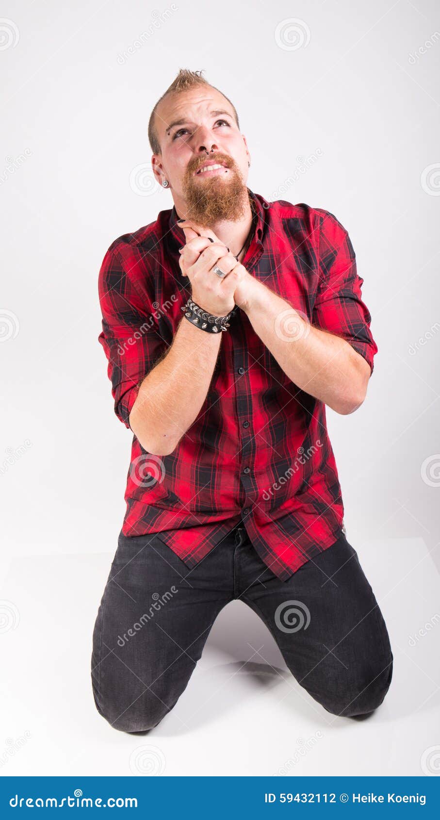 Man kneeling on the floor stock photo. Image of pose 59432112