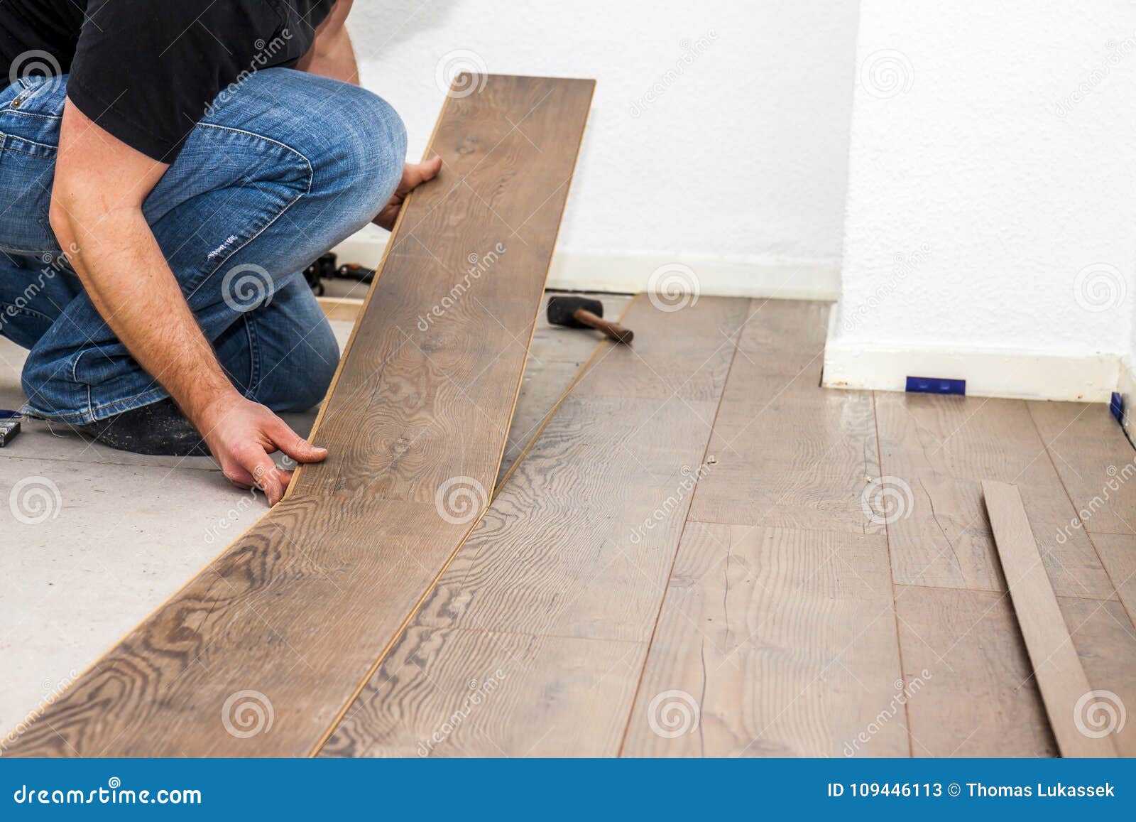 Man Laying Laminate In Socks Stock Image Image Of Parquet