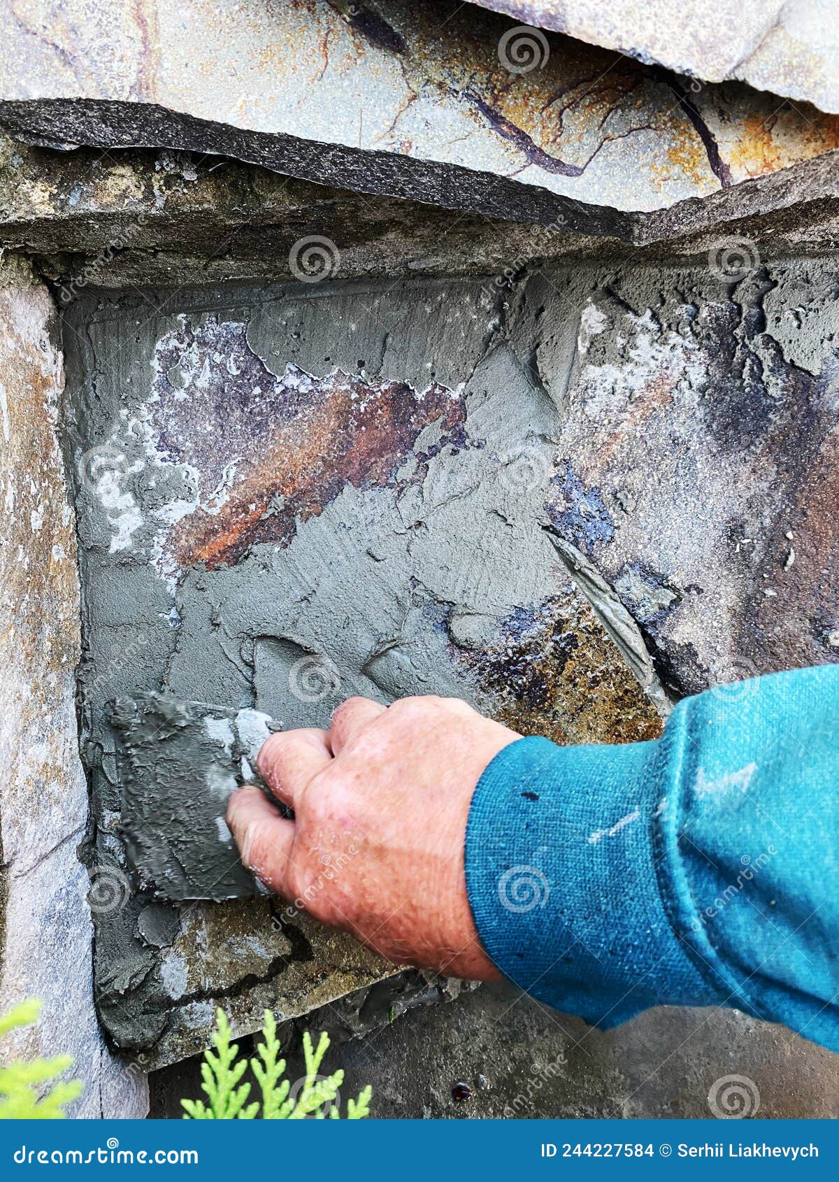 A Man Lays a Stone on the Paths on the Mortar Stock Photo Image of
