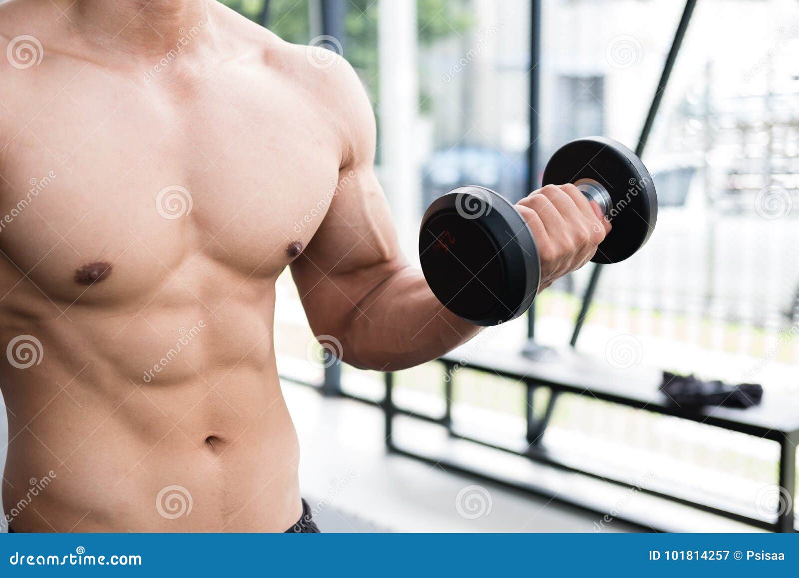 Man Lift Dumbbell In Gym Bodybuilder Male Working Out In Fitness