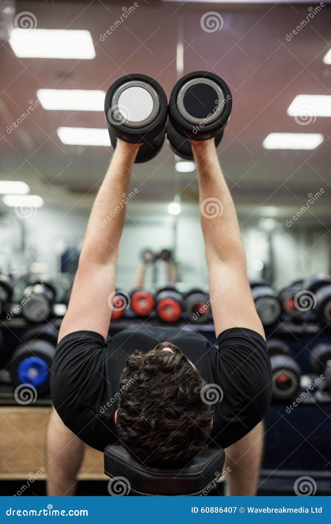 Man Lifting Dumbbell Weights while Lying Down Stock Image Image of