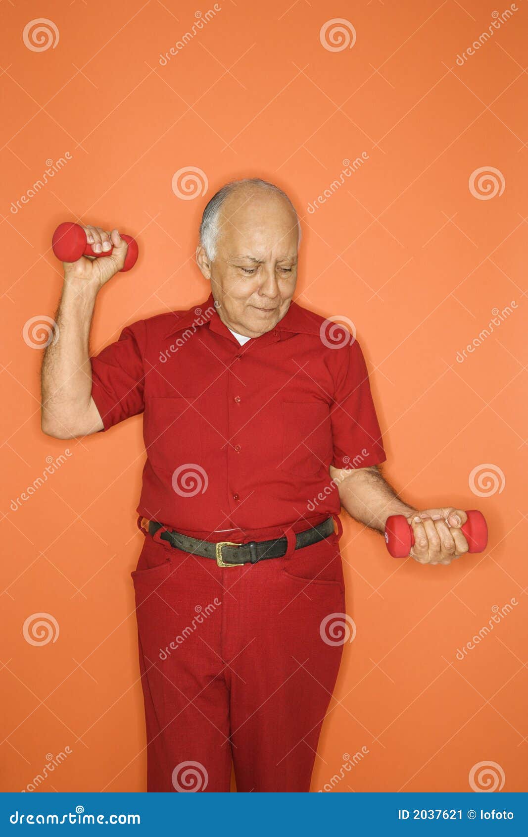 Man lifting hand weights. stock image. Image of indoors 2037621