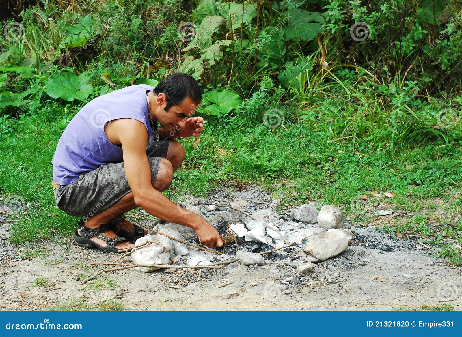 Man lighting fire stock photo. Image of outdoors, flame 21321820