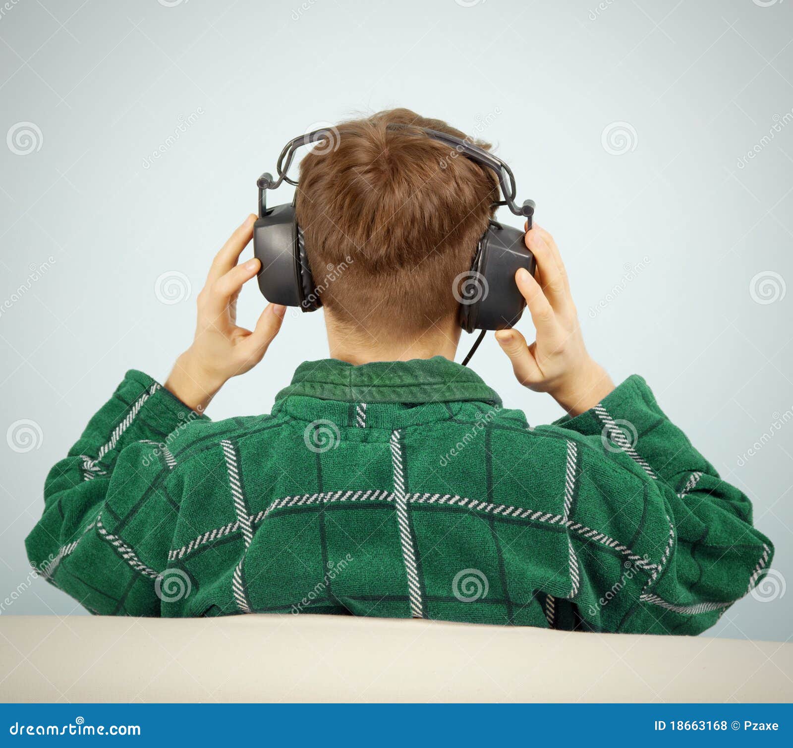 man listens to symphonic music at home on couch