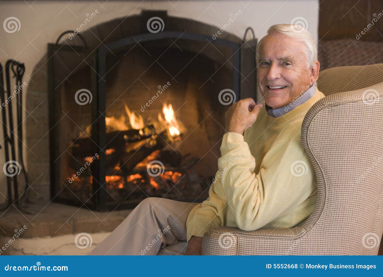 Man in Living Room by the Fireplace Smiling Stock Photo Image of
