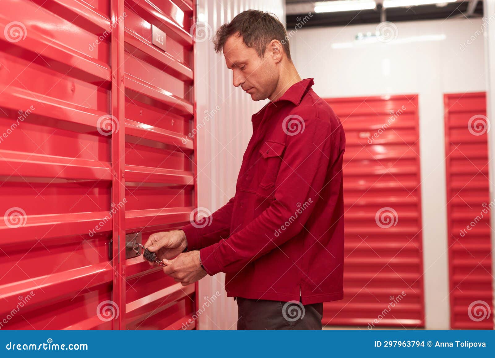 Man Locking Storage Unit in Warehouse Stock Photo Image of property