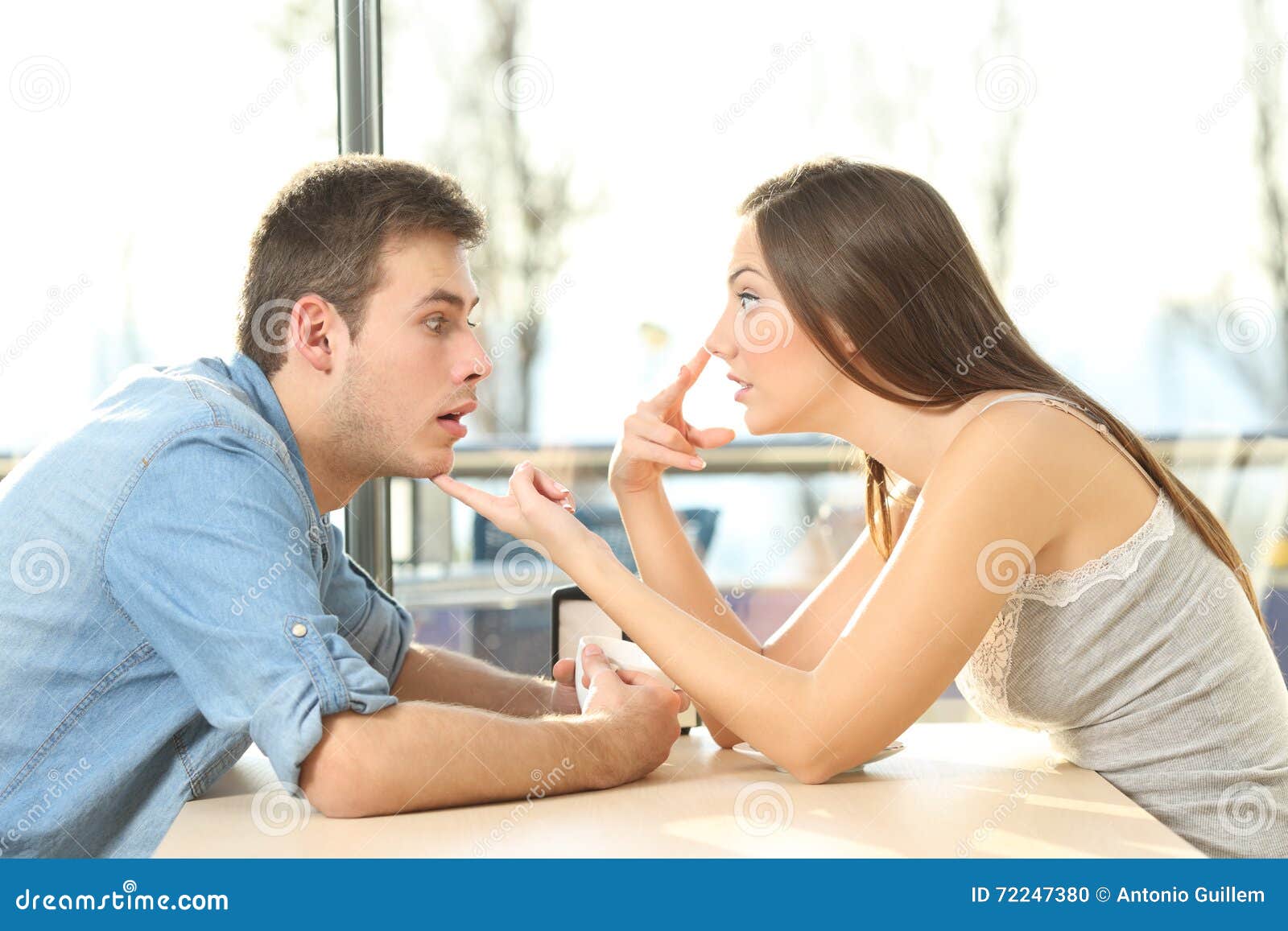 man looking at bosom of a girl in a date