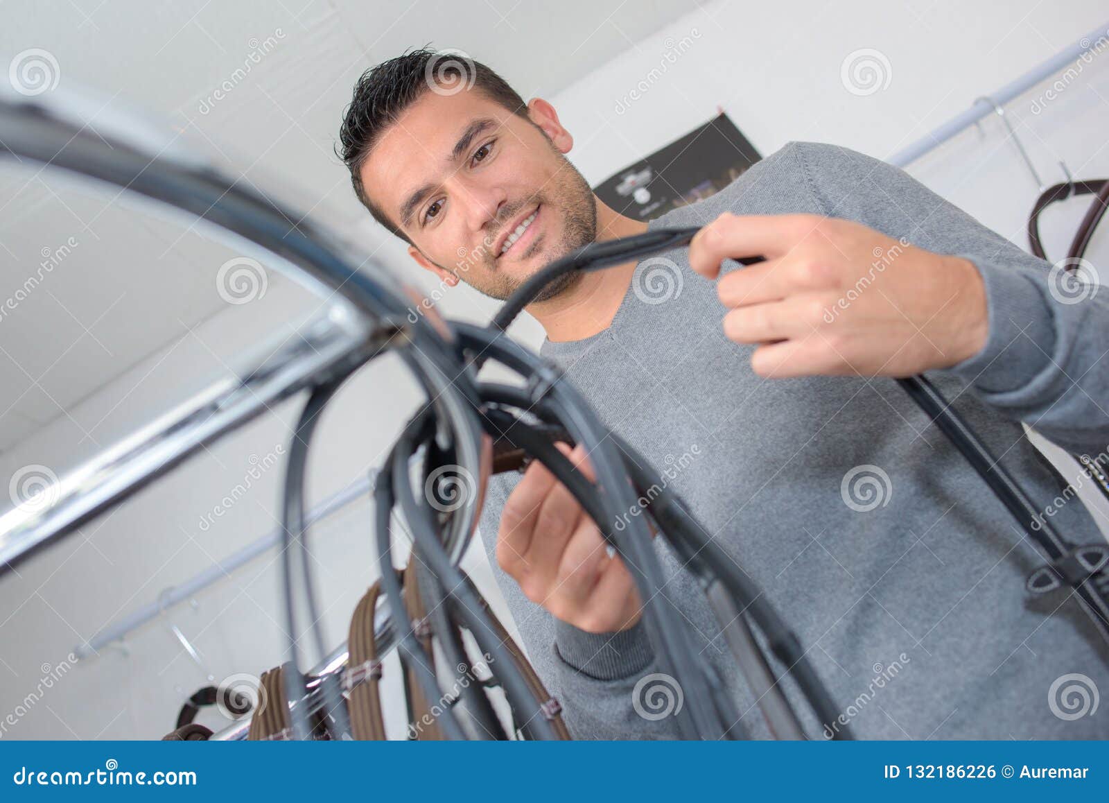 man looking at bridle