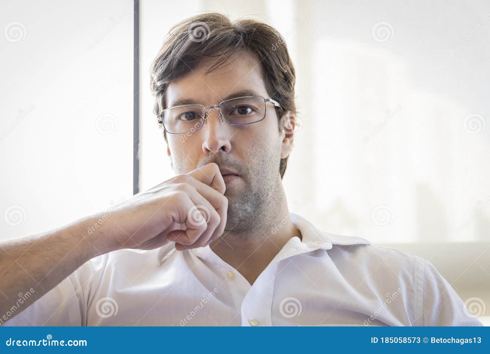 Man Looking Directly At The Camera Making A Conference Call Stock Image