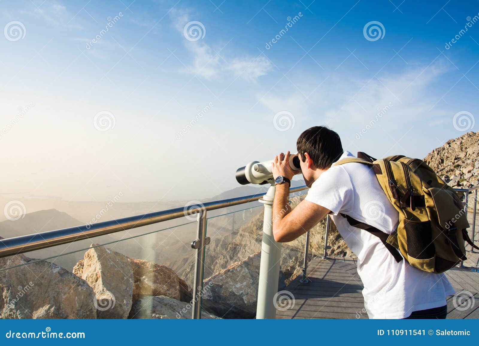 Man Using Public Binoculars at the Mountain Top Stock Image Image of observe, backpack 110911541