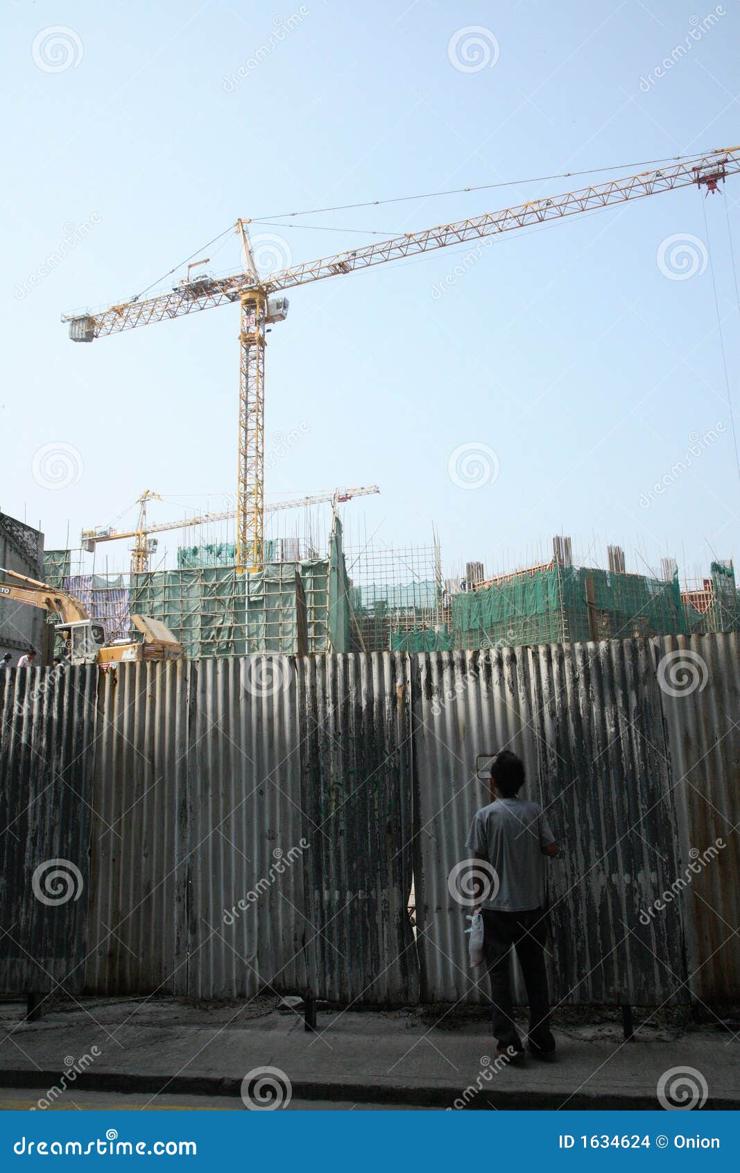 Man looking through wall stock photo. Image of construction 1634624