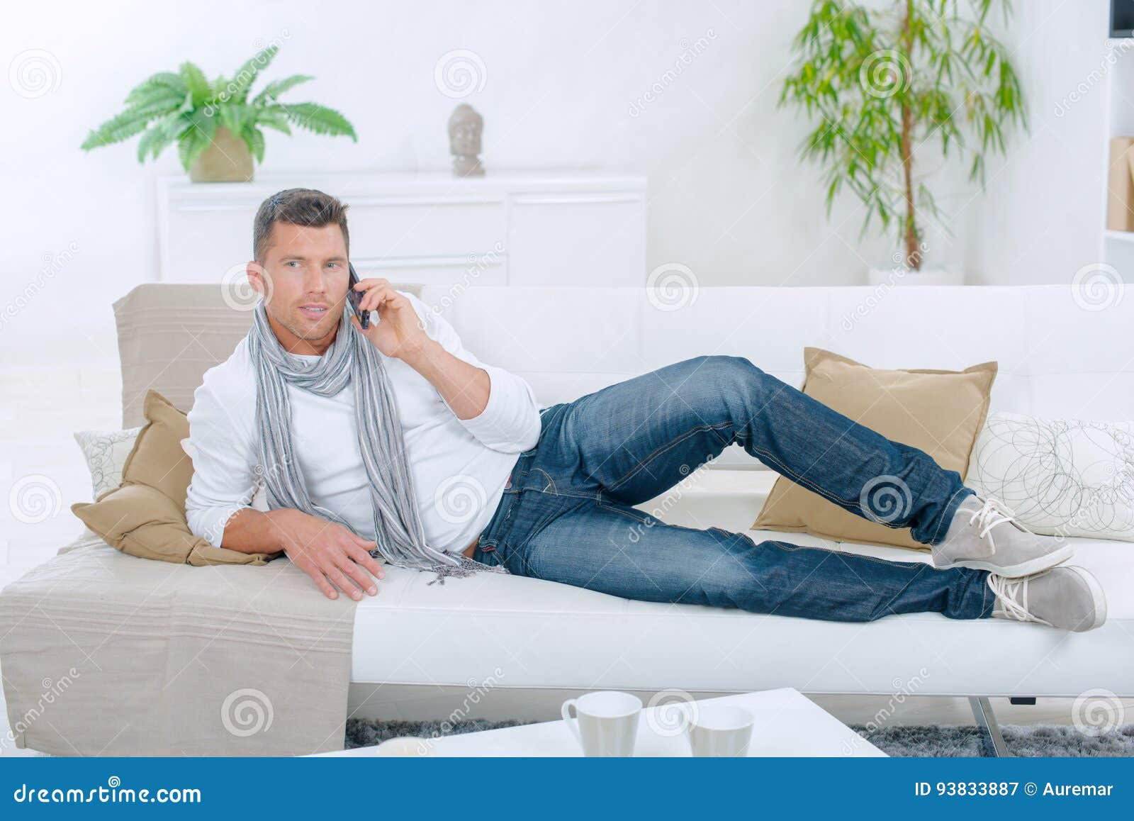 man-lounging-sofa-93833887.jpg