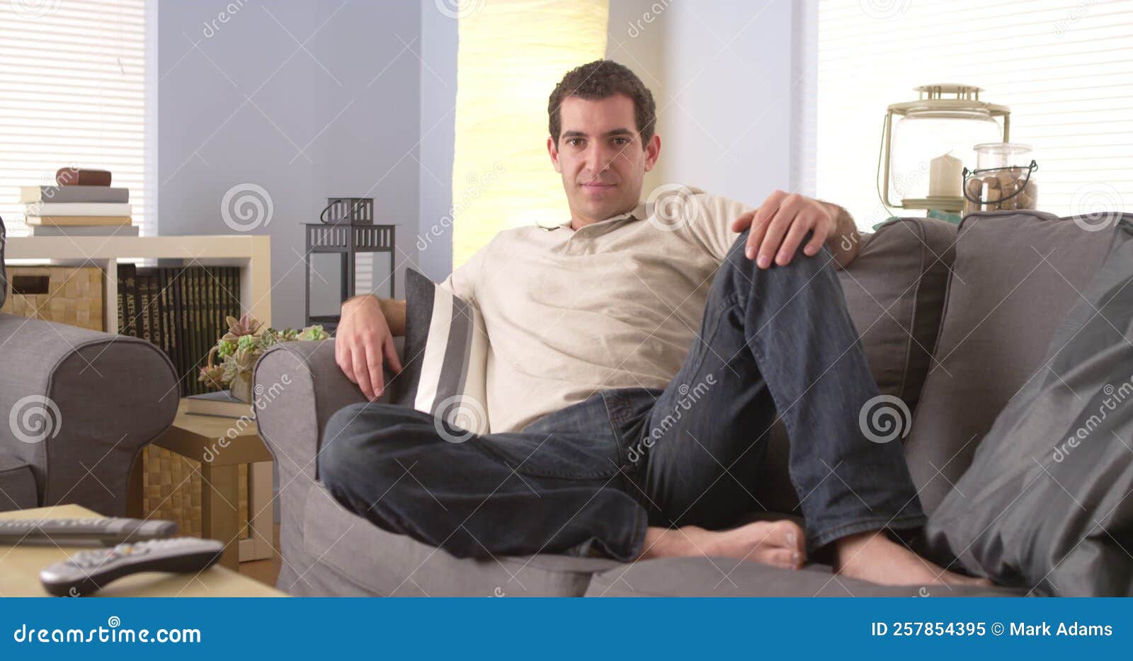 Man lounging on sofa stock video. Video of sofa, couch 257854395