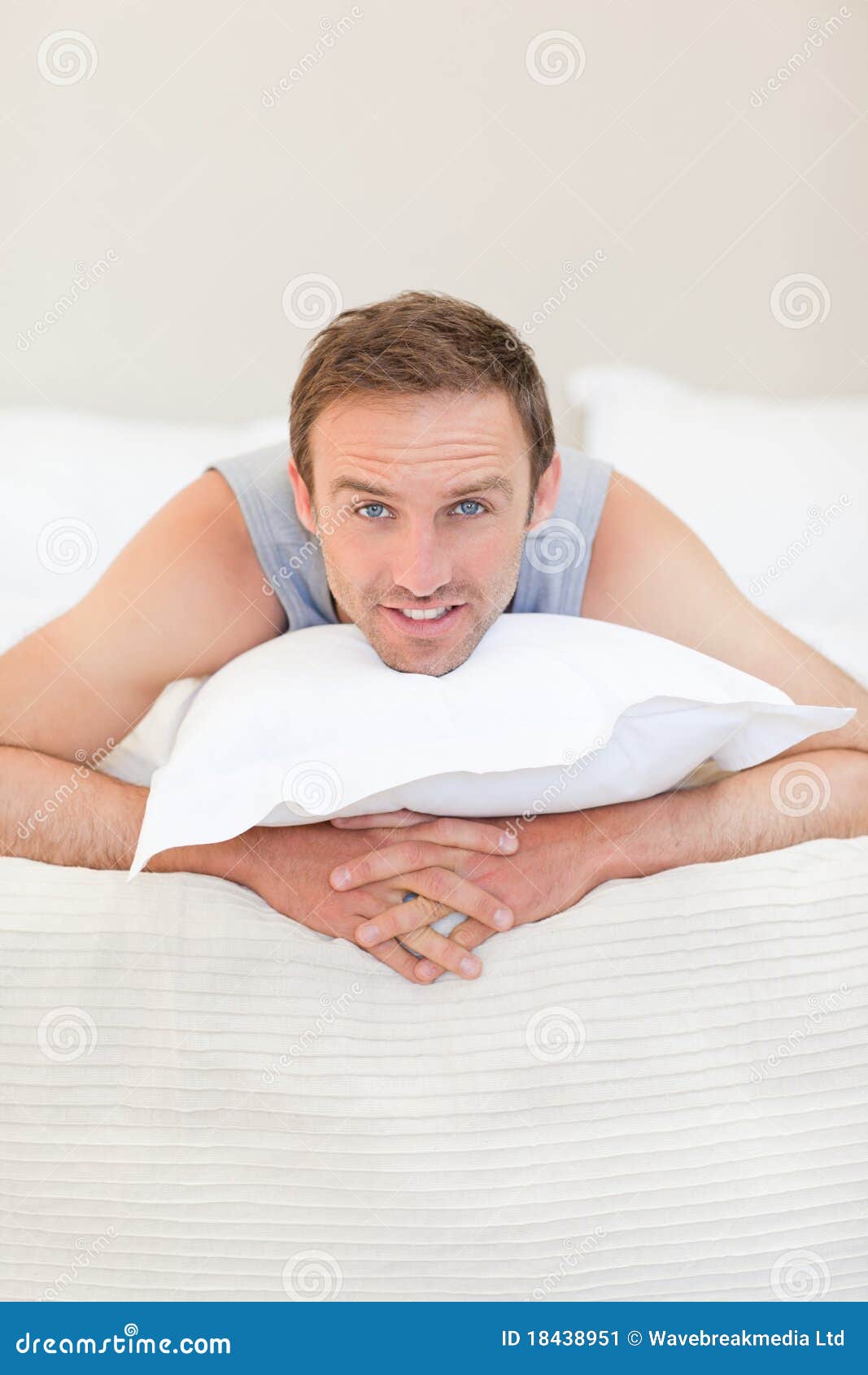 Man lying down on his bed stock image. Image of length 18438951