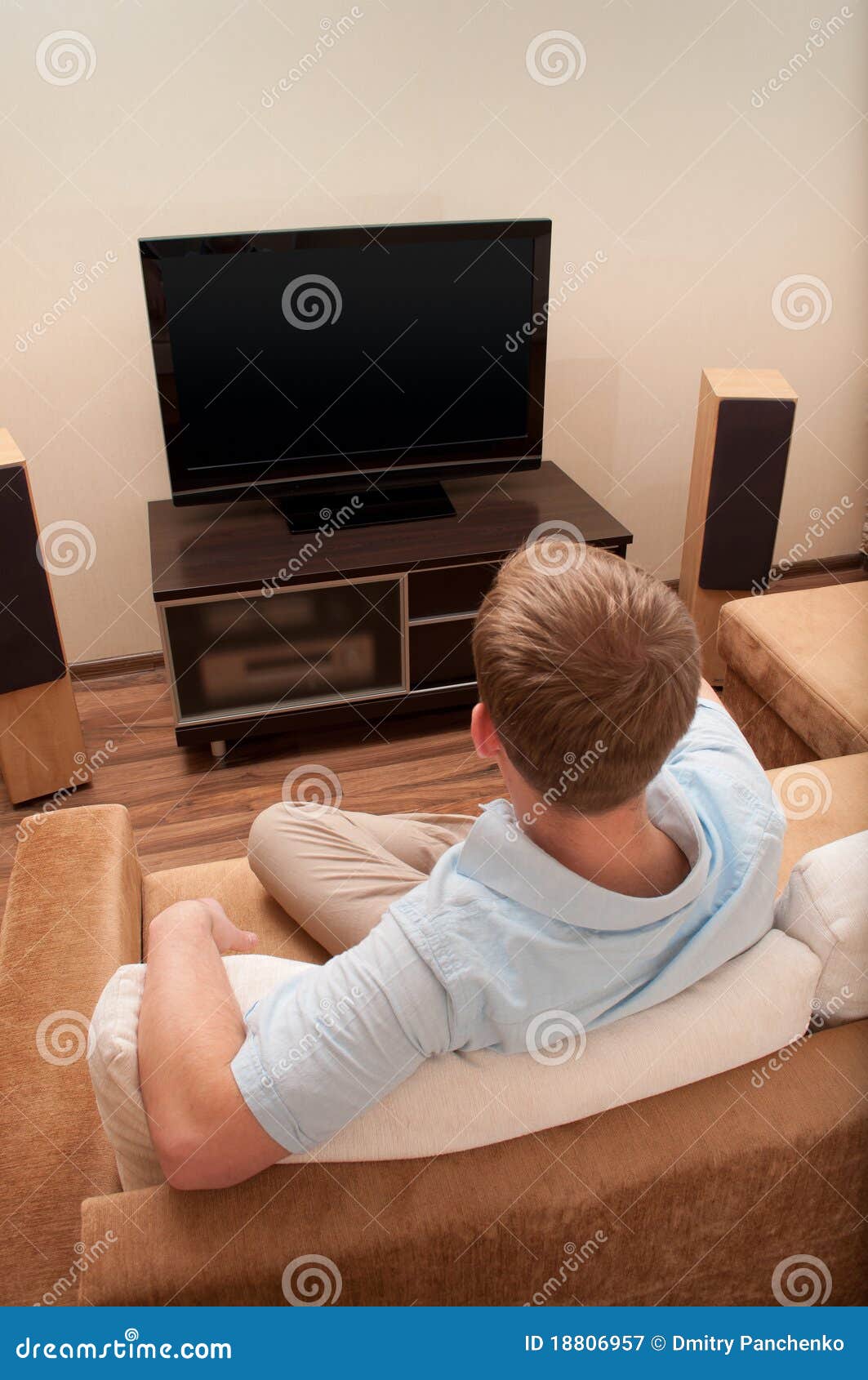 Man Lying on Sofa Watching TV Stock Image Image of furniture, device