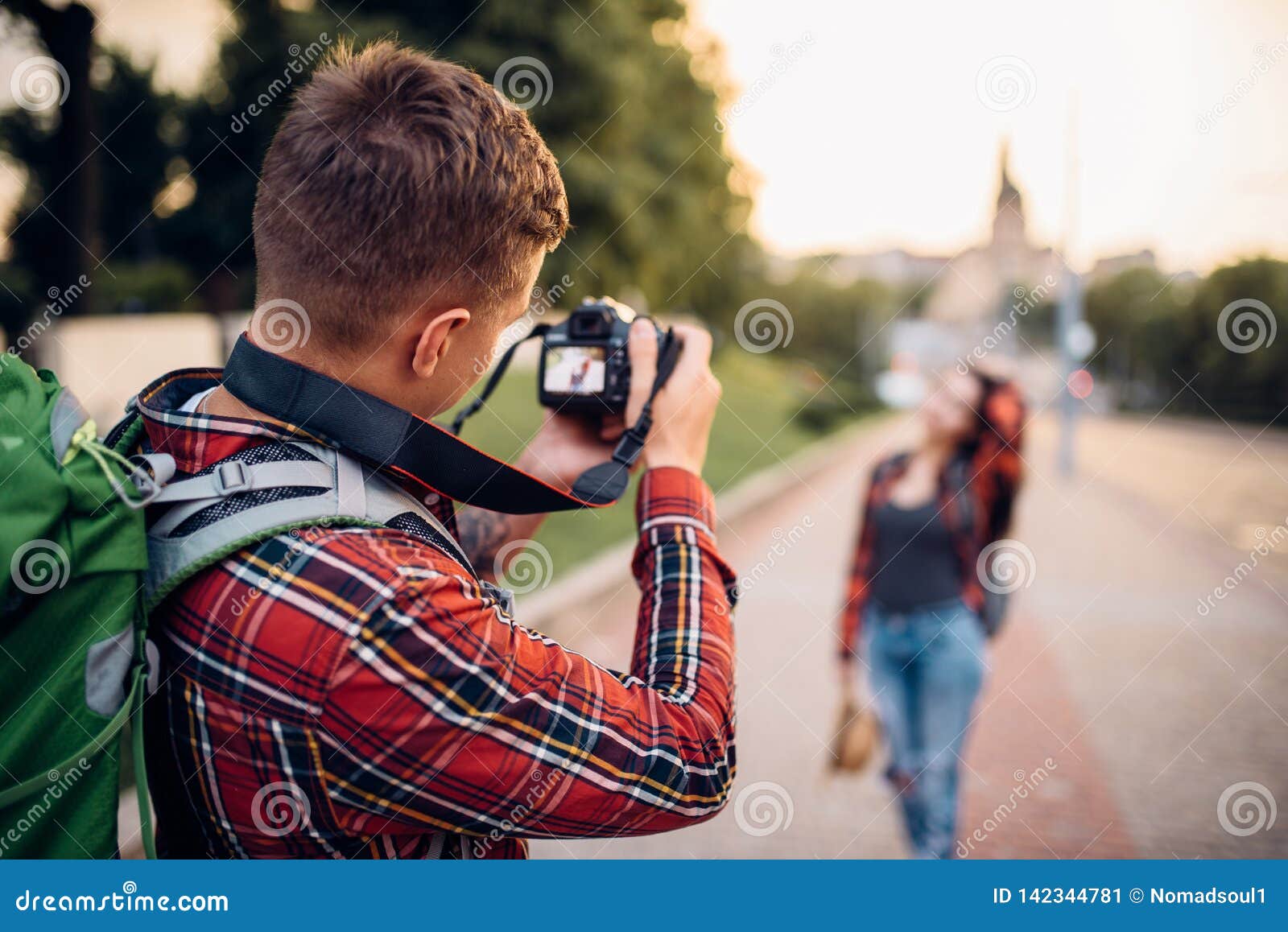 10 year old indian boy holding digital camera or DSLR camera, posing like a  professional photographer, young photographer, kid photographer, child  photographer, portrait, closeup, red background Stock Photo | Adobe Stock