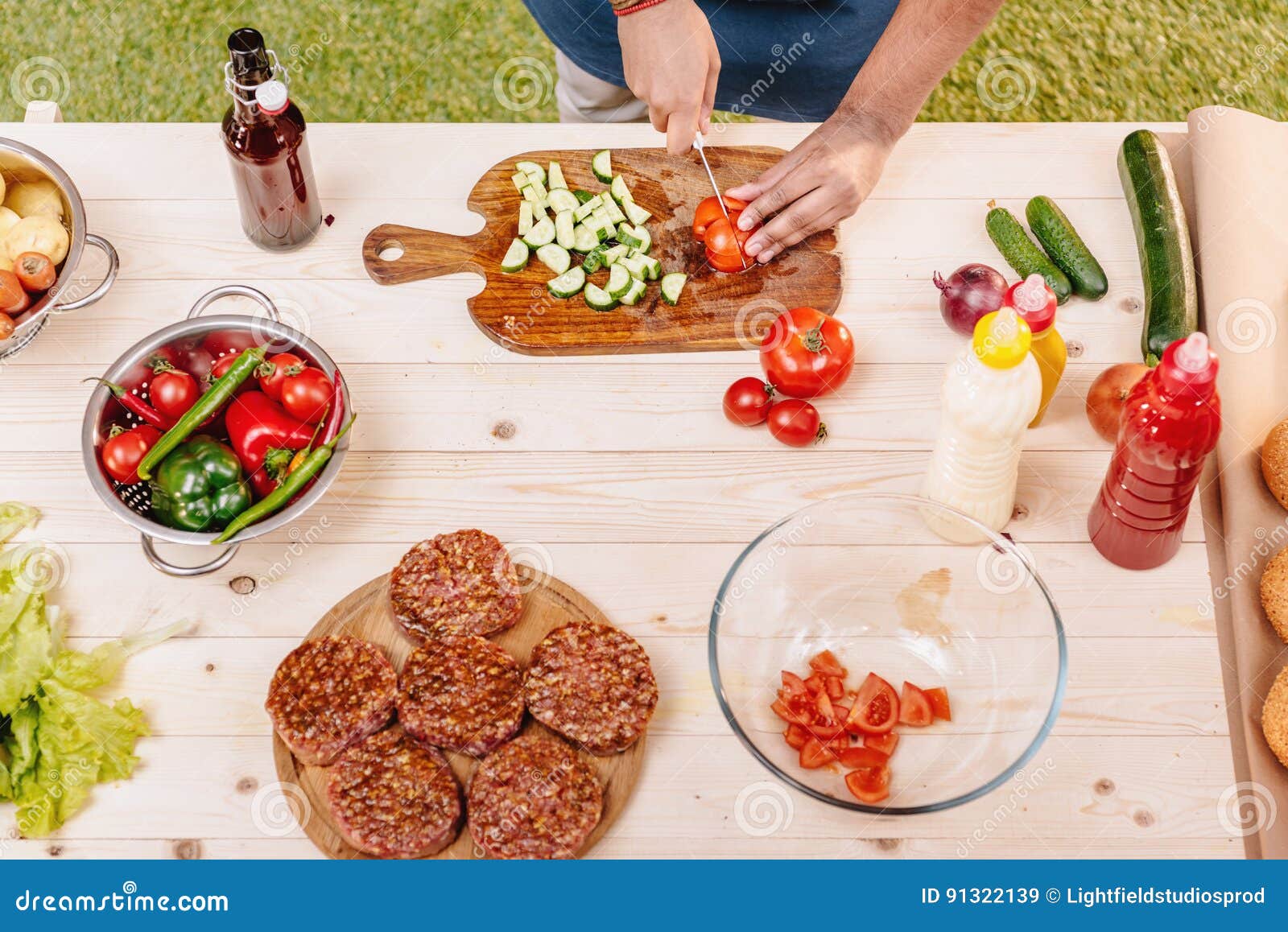Man Making Burgers and Cutting Red Tomatoes Stock Image Image of