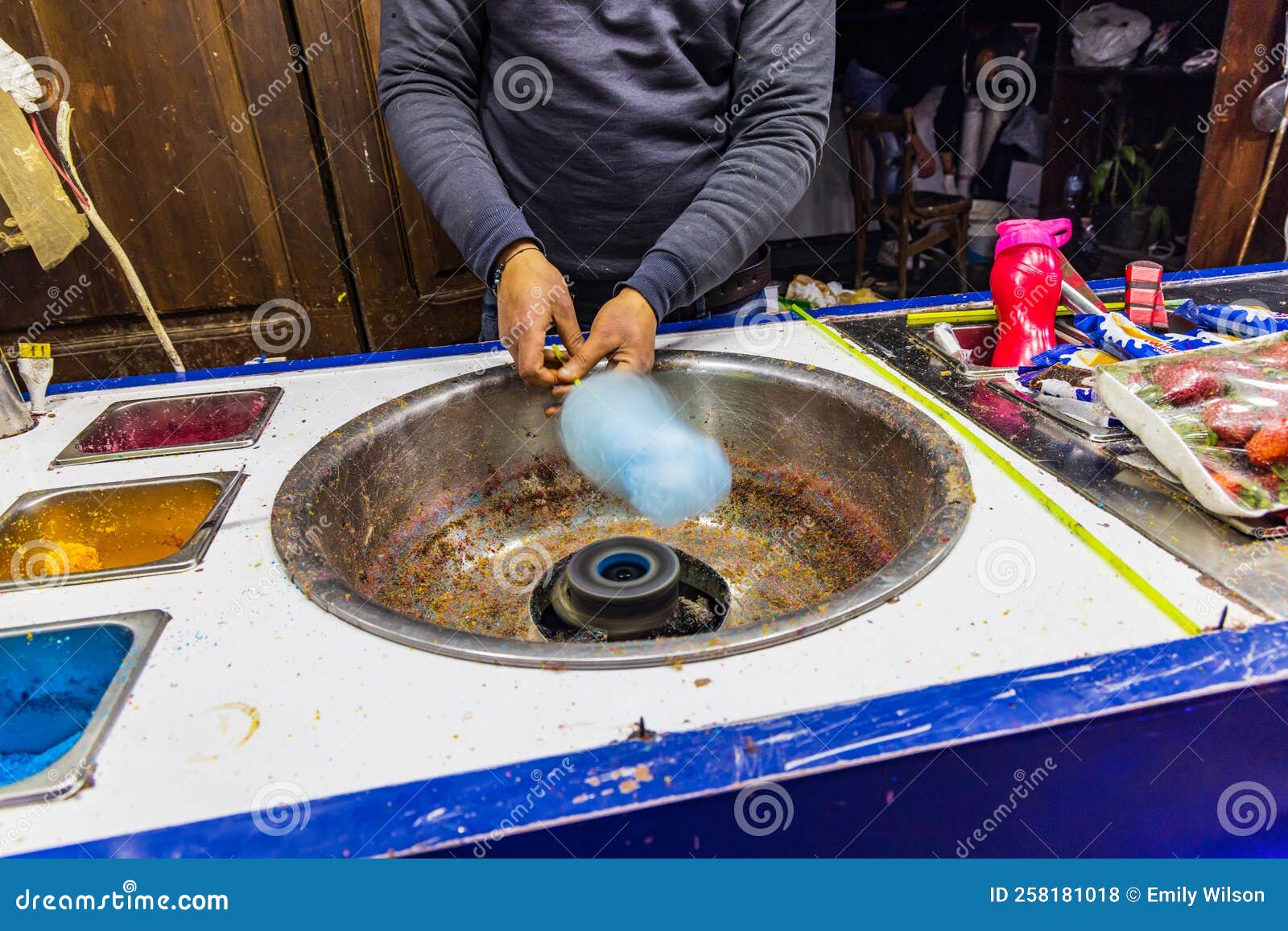 man making spun sugar, cotton candy, at a shop on el moez street in old cairo