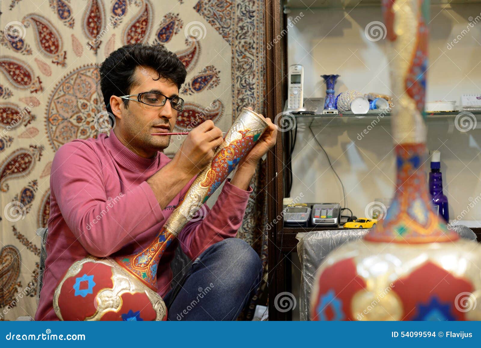 Man making traditional iranian vase, Iran. Unknown man making traditional iranian vase in market (Bazaar) in Isfahan, Iran on April 19, 2015. Bazaar of Isfahan is the most important tourist attraction in Isfahan, Iran.