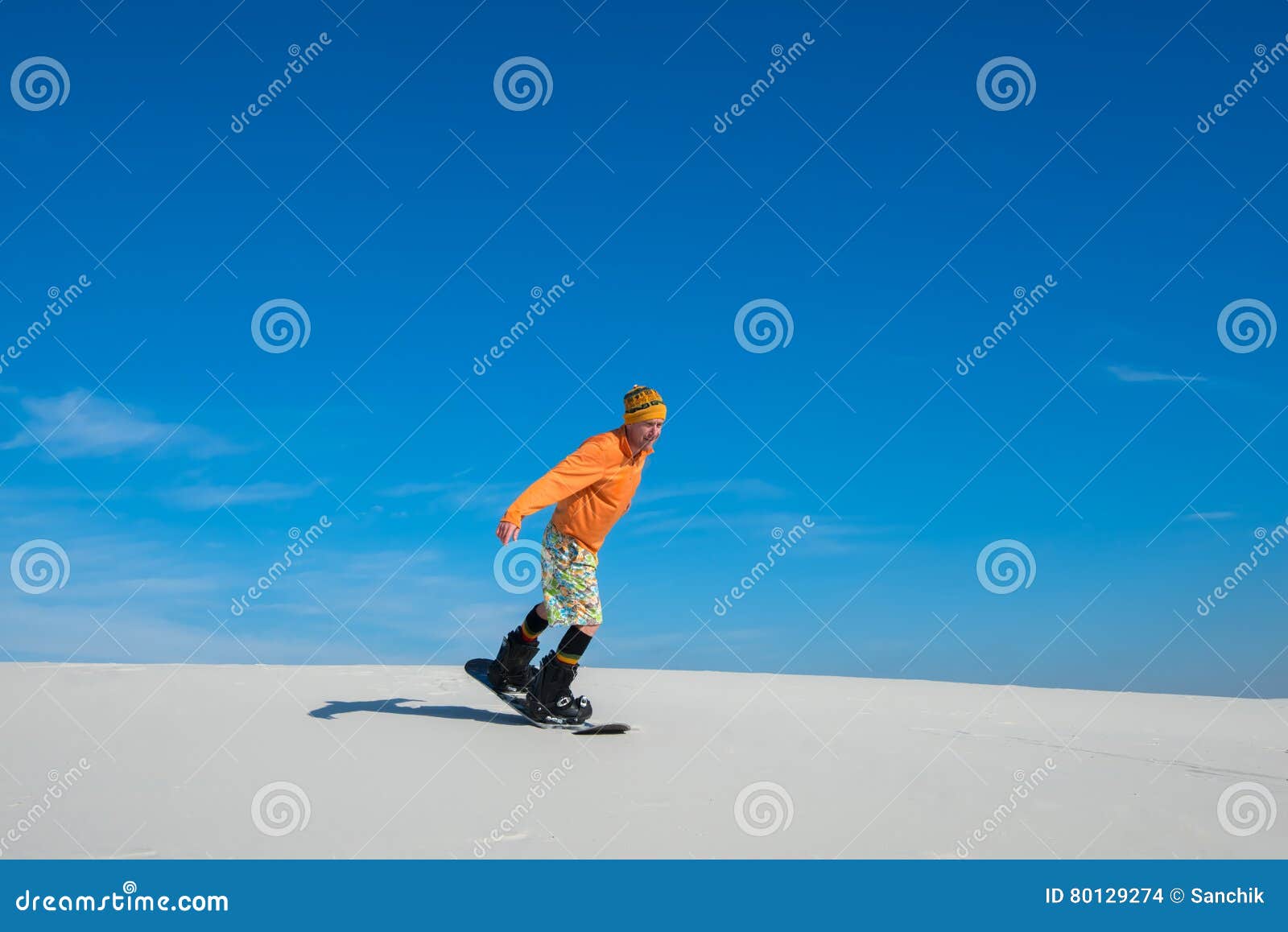 Man Making a Trick on Snowboard on Sand Slope Stock Photo - Image of ...