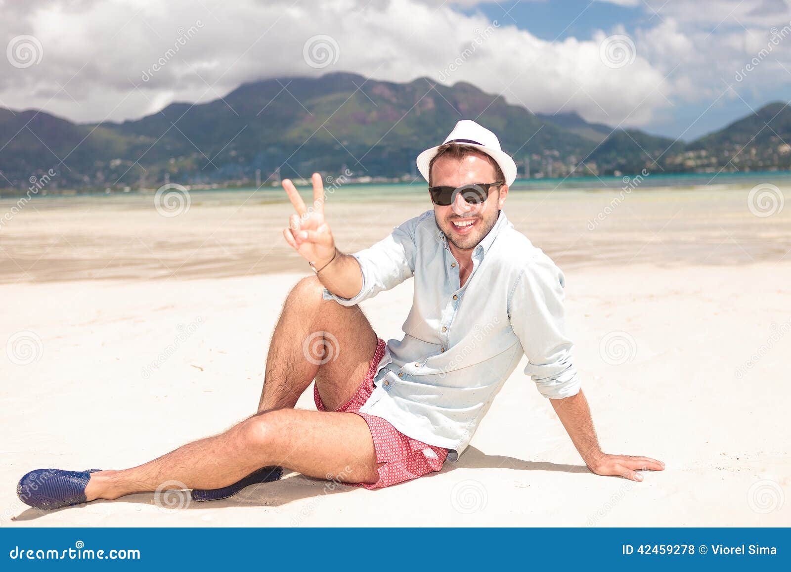Man Making the Victory Peace Sign on the Beach Stock Photo - Image of ...