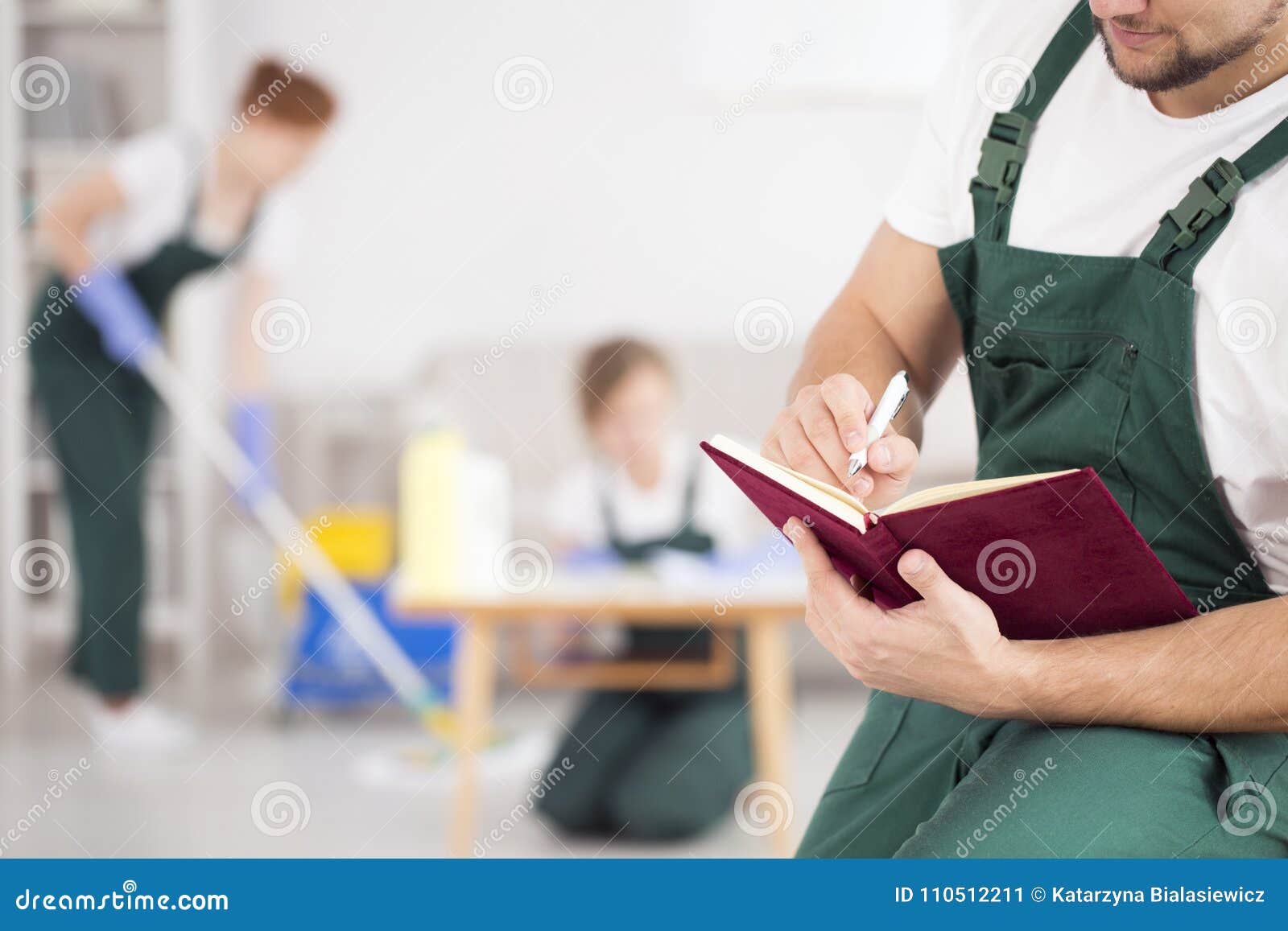 Man managing cleaning crew stock image. Image of manual 110512211