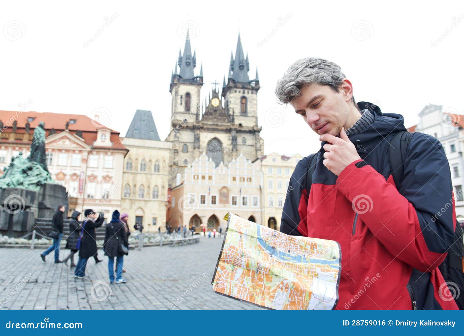 man with map over tourist attraction