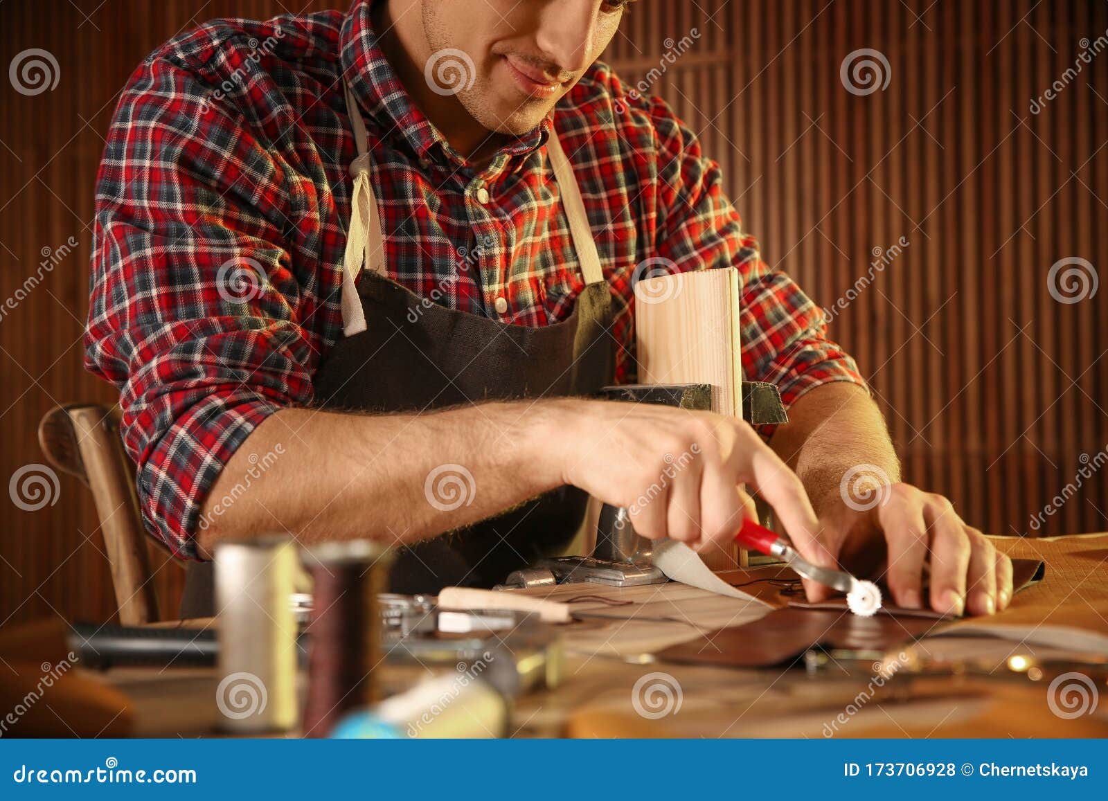 Man Marking Leather with Roller in Stock Photo Image of