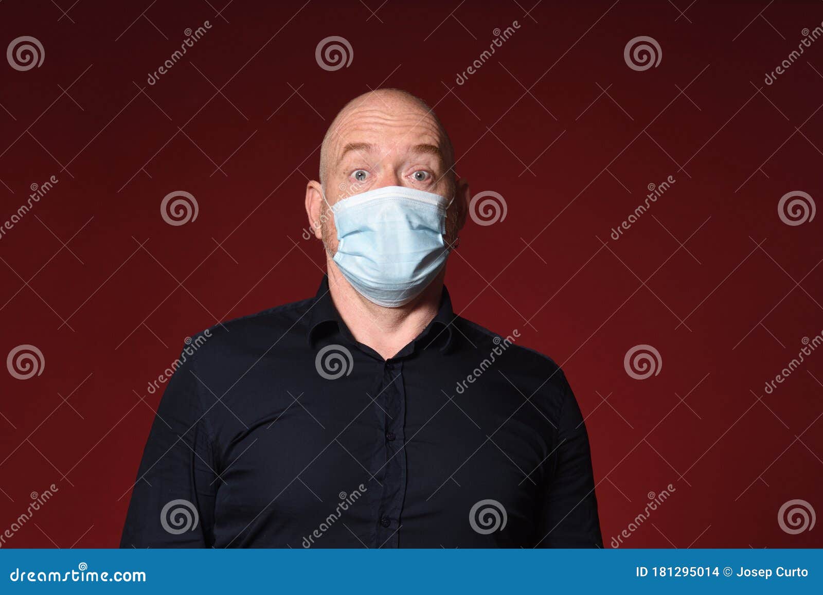 man with mask and gloves with face surprise expresion on red background