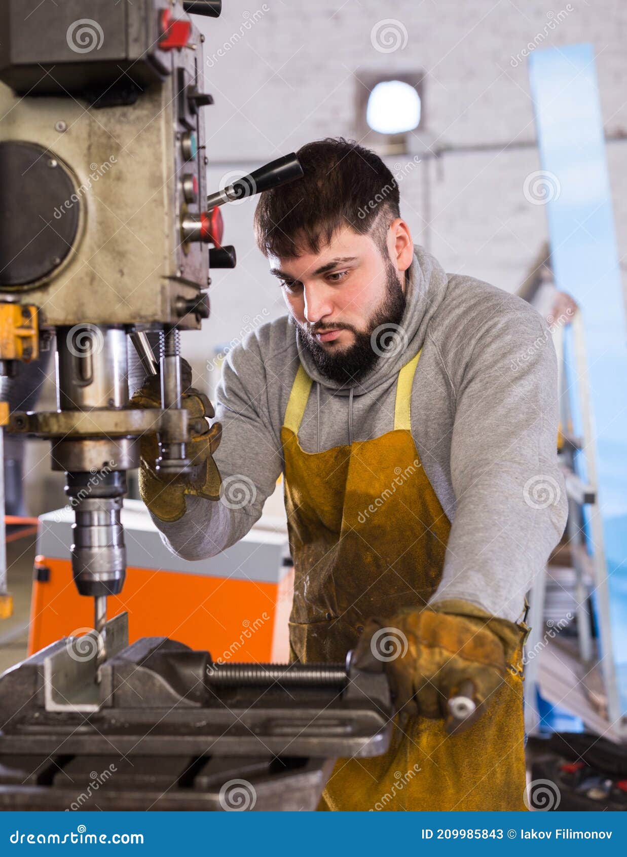 Man Mechanic Using Drilling Machine in Stock Image Image of