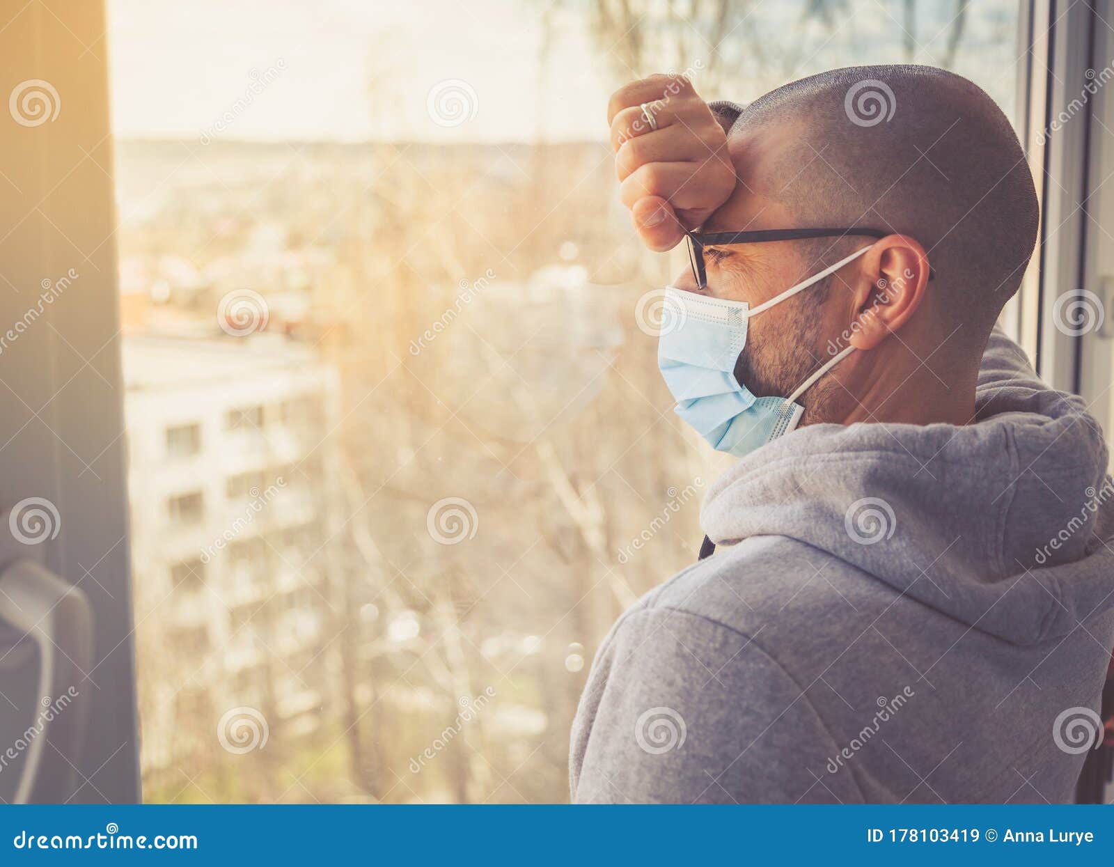 man in medical mask in home quarantine