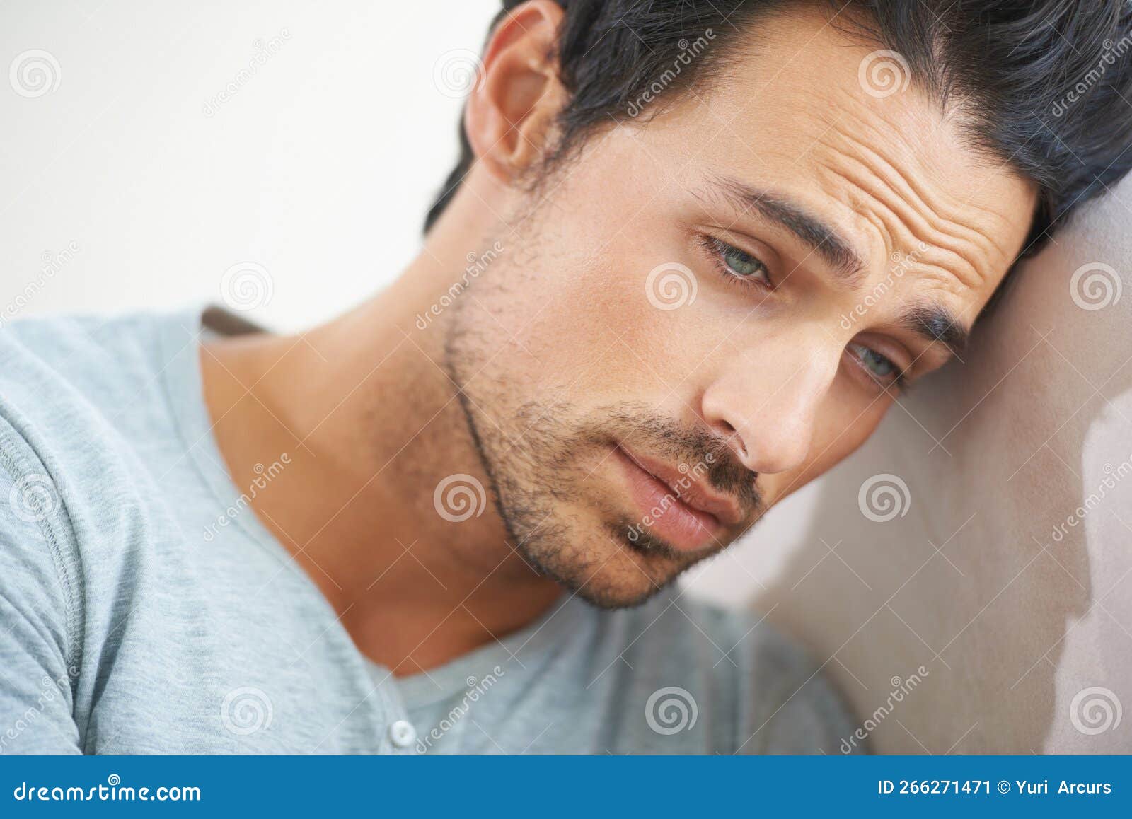 Man of Melancholy. a Gorgeous Young Man Resting on a Sofa at Home with