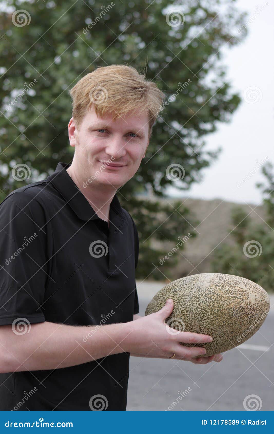 Man with melon stock image. Image of looking, market 12178589