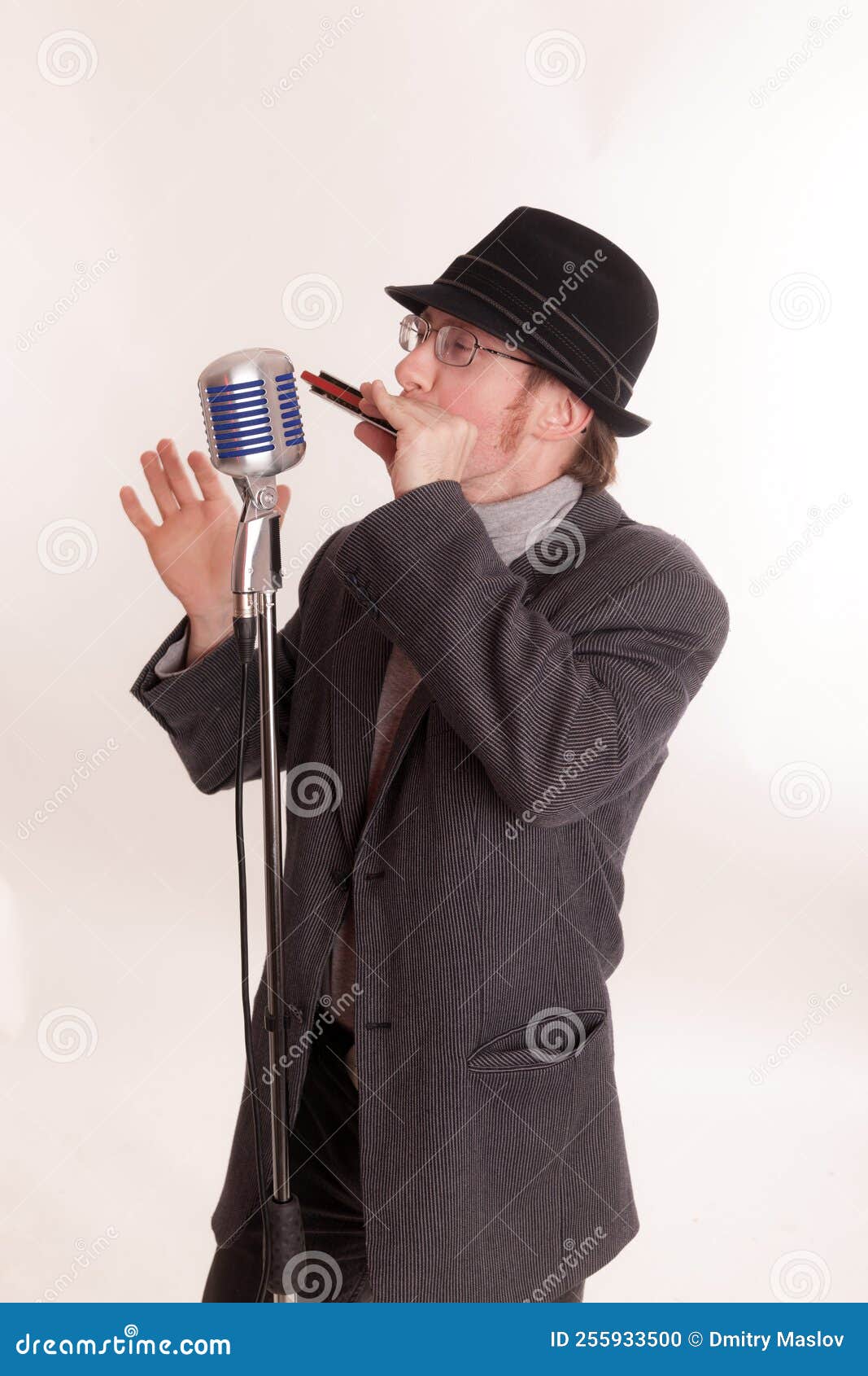 Man with a Microphone Playing the Harmonica Stock Photo Image of playing, suit 255933500