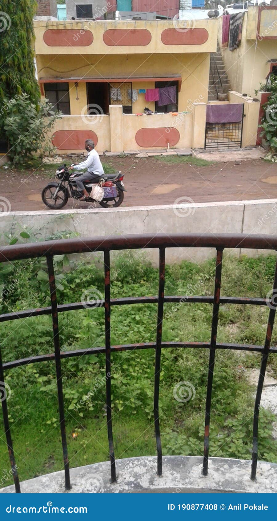 a man on motorcycle with consumables on bags