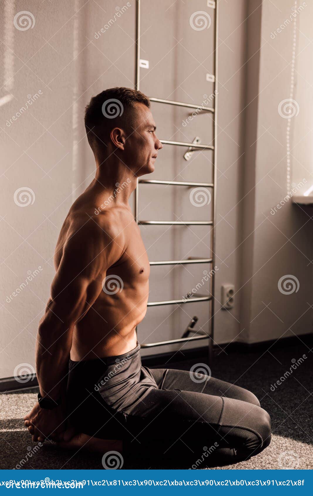 A Man With A Naked Torso Sits On The Floor Athletic Body Stock Image