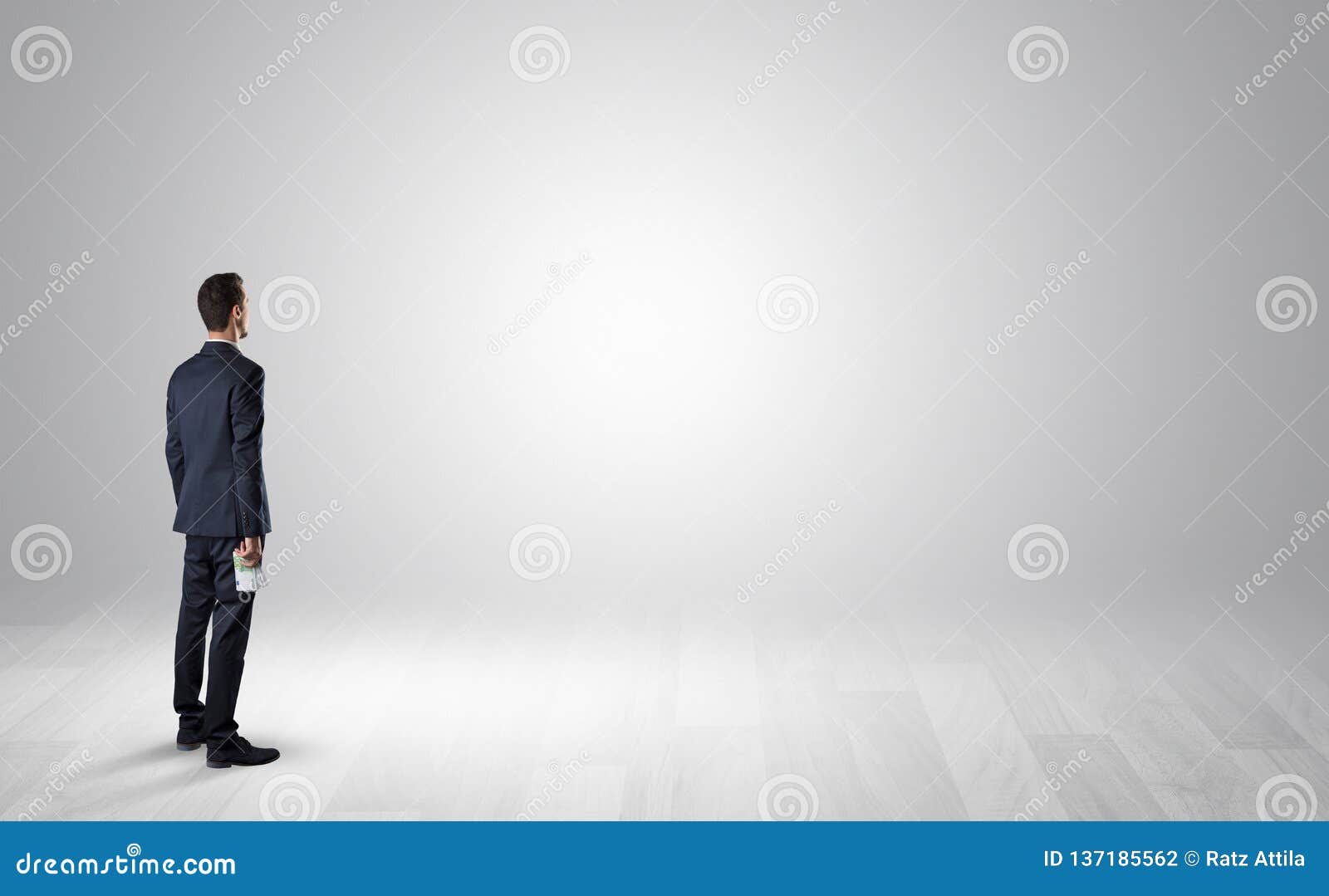 Man with Object in His Hand in an Empty Space Stock Photo - Image of ...