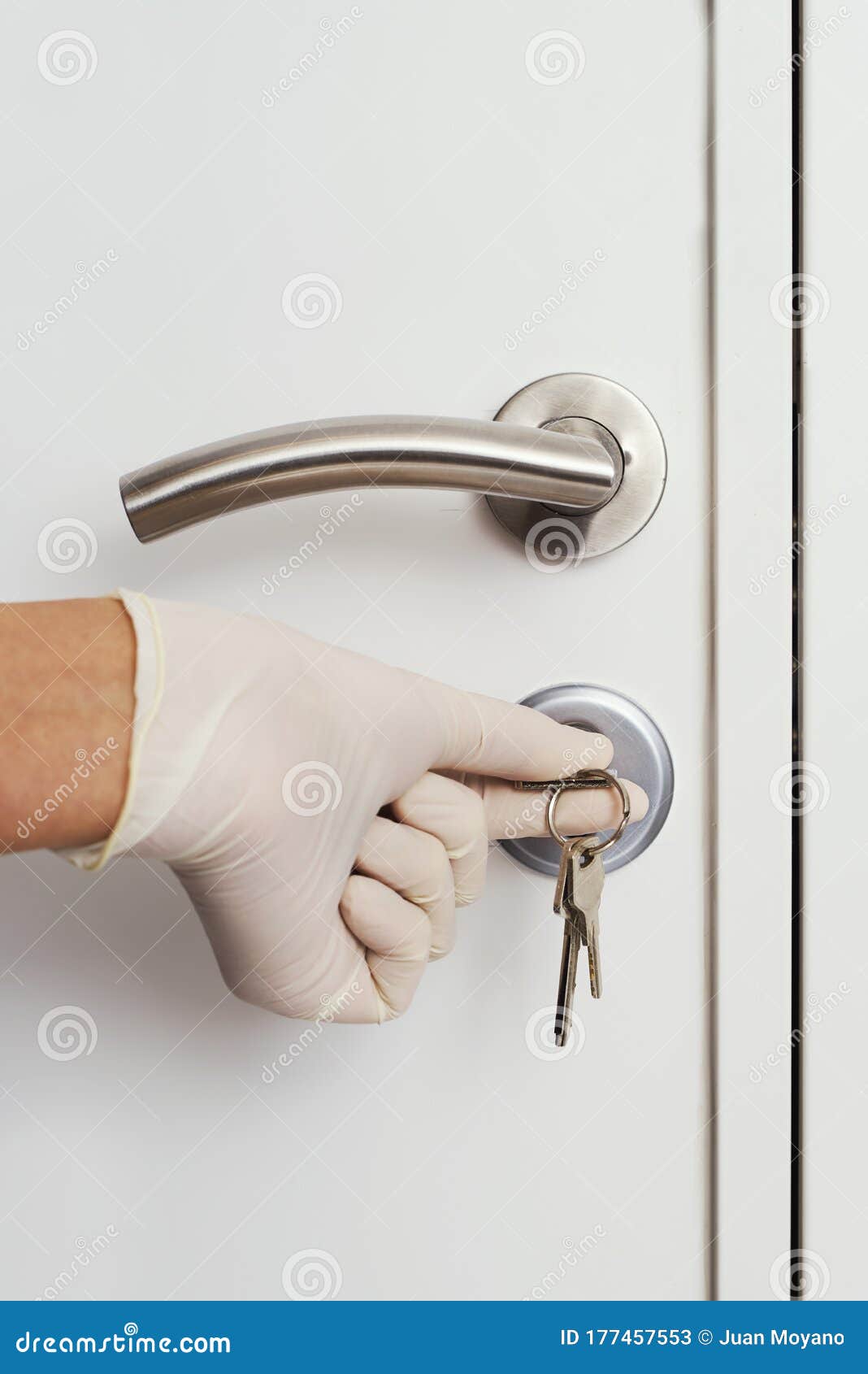 man opening a door wearing latex gloves