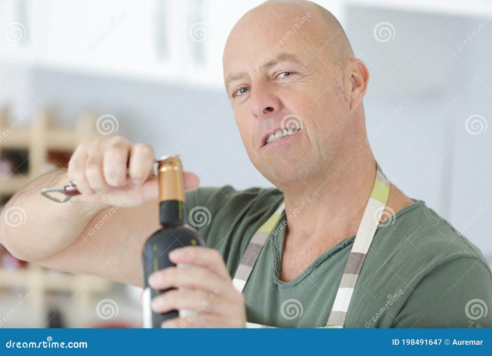 Man Opening Red Wine Bottle with Metal Corkscrew Stock Image Image of
