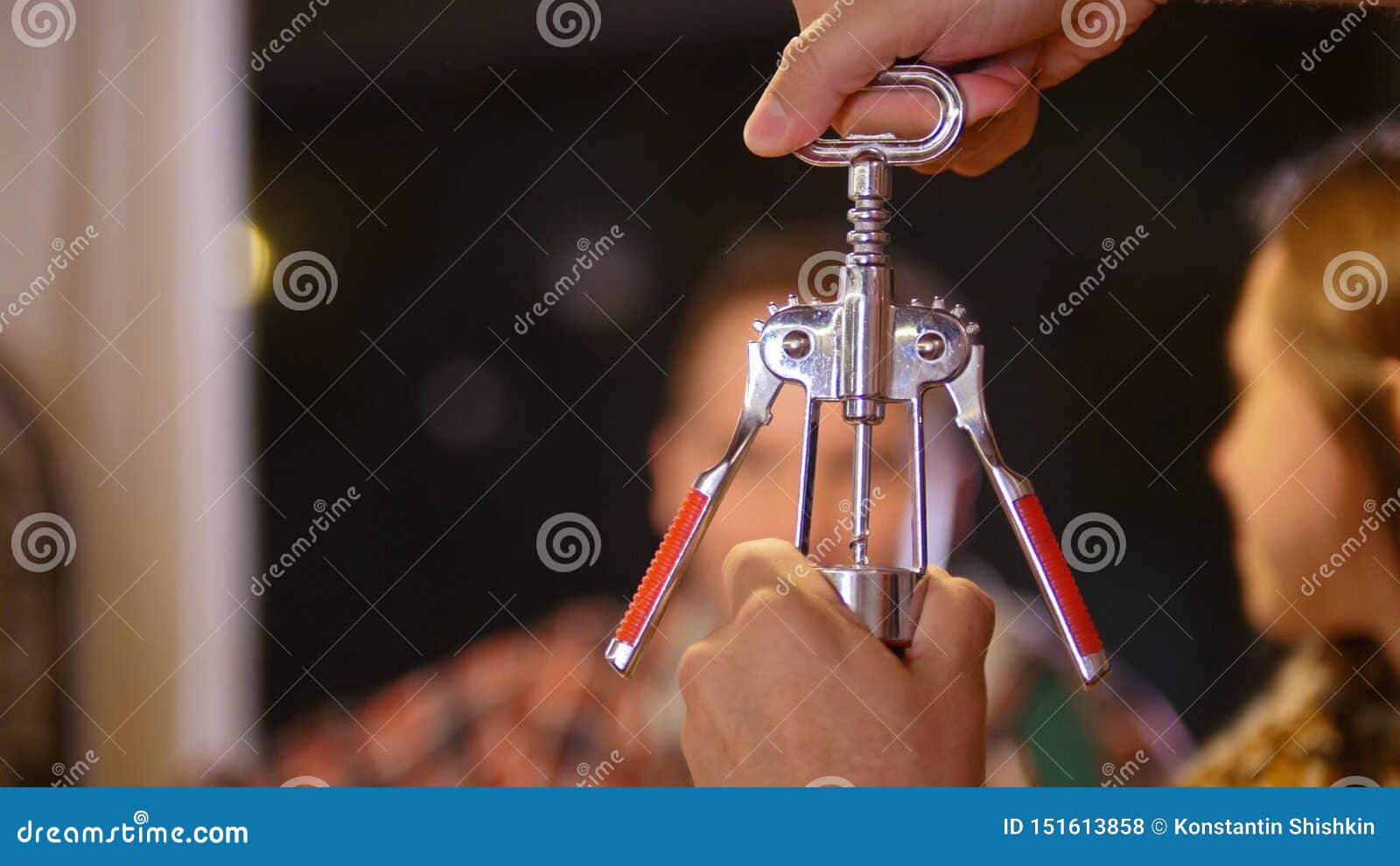 Man Opens the Bottle of Wine with a Corkscrew Stock Photo Image of