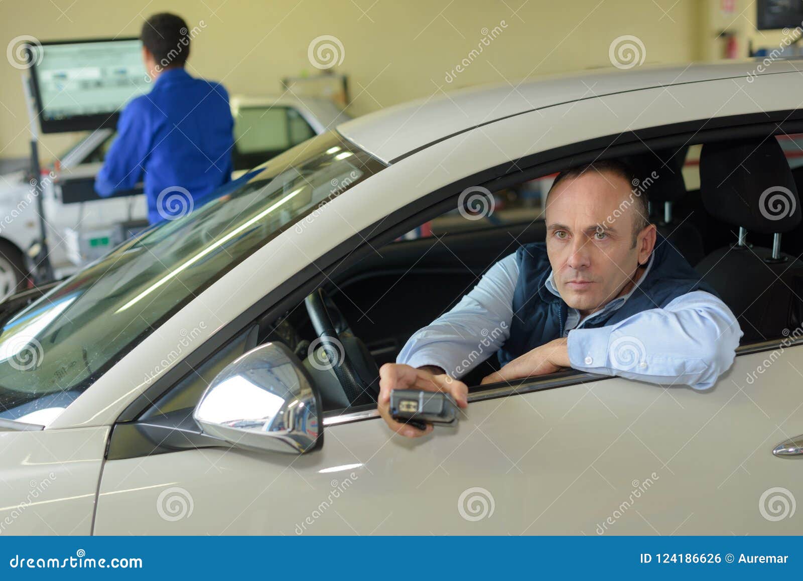 Man Operating Controls in Vehicle Test Station Stock Photo - Image of ...