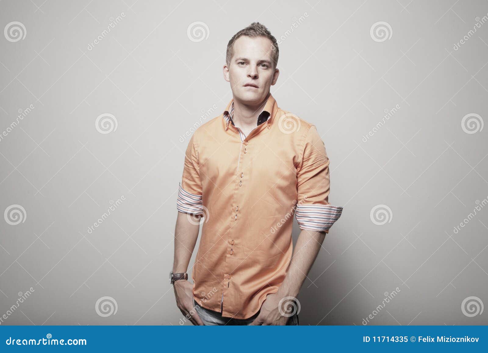 Man in an orange shirt stock image. Image of orange, single 11714335